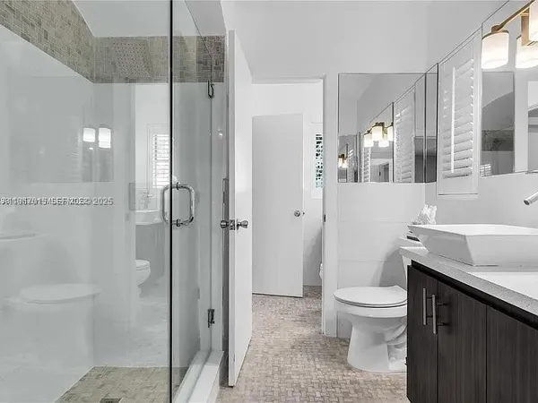 a bedroom with a bed and tv