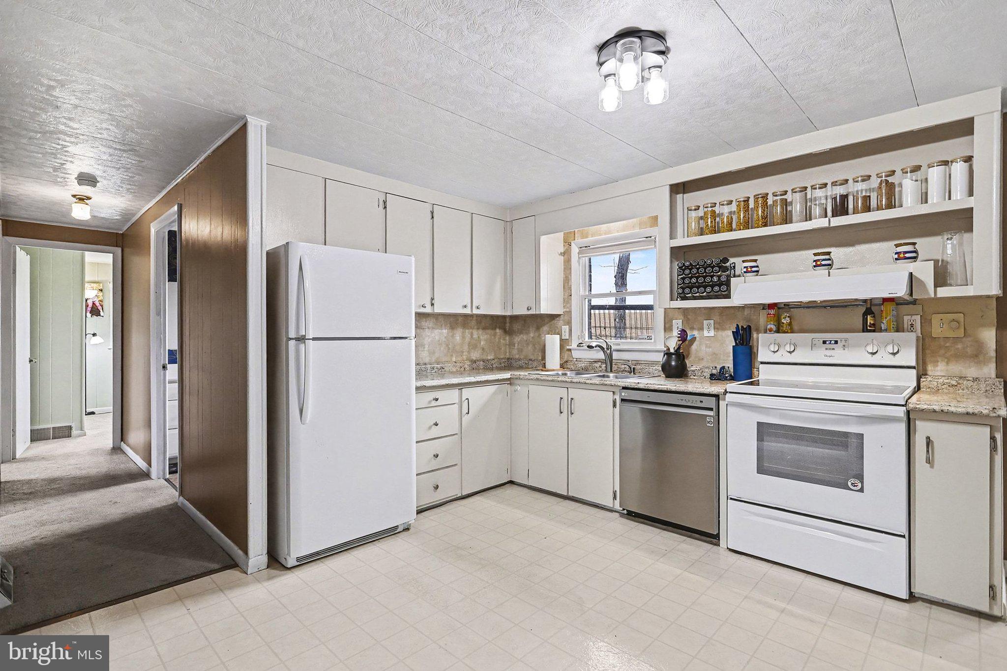 5405 West Canal Road East Berlin, PA 17316 - Photo 13 of 45 a kitchen with a refrigerator sink and cabinets