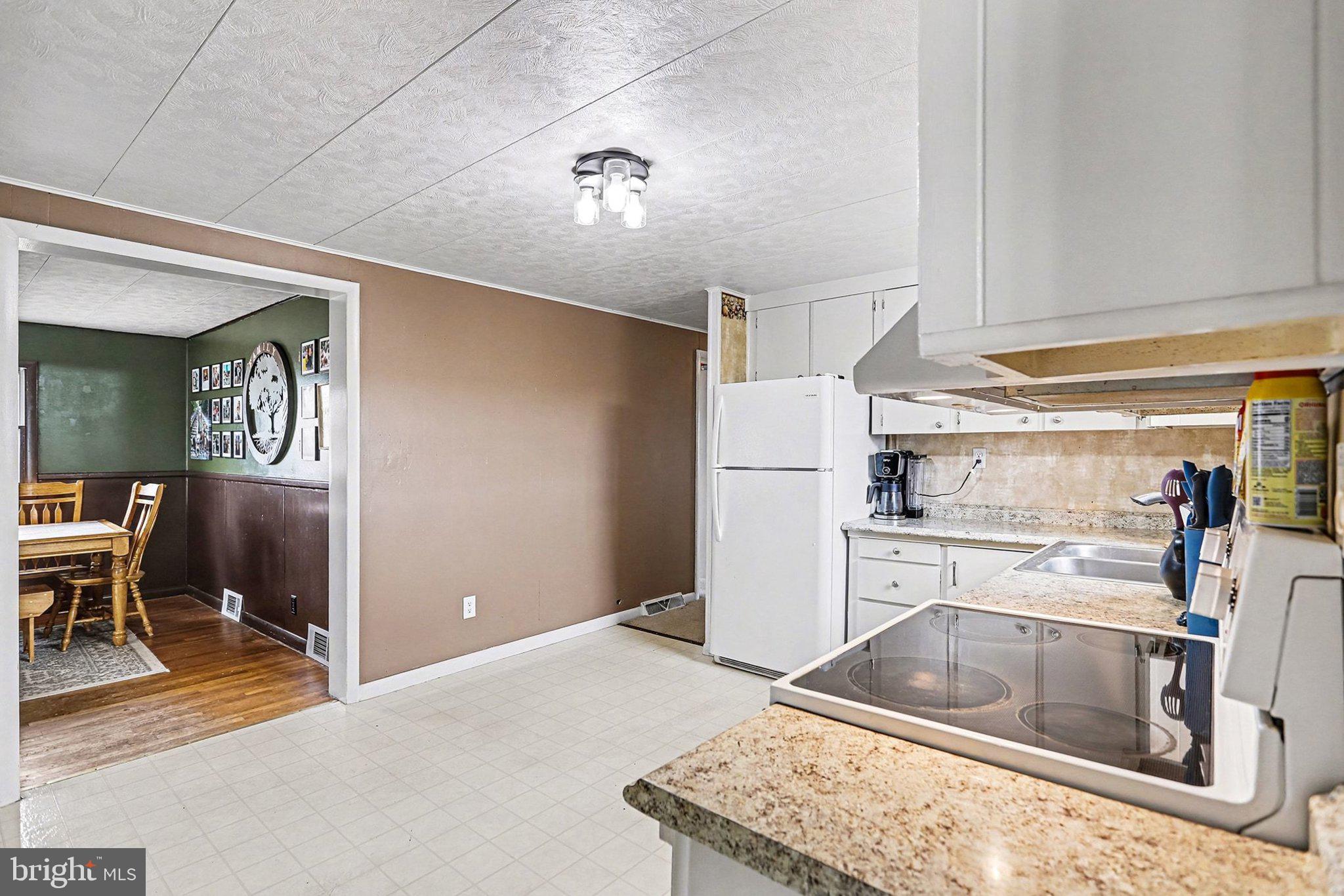 5405 West Canal Road East Berlin, PA 17316 - Photo 14 of 45 a kitchen with a refrigerator sink and cabinets