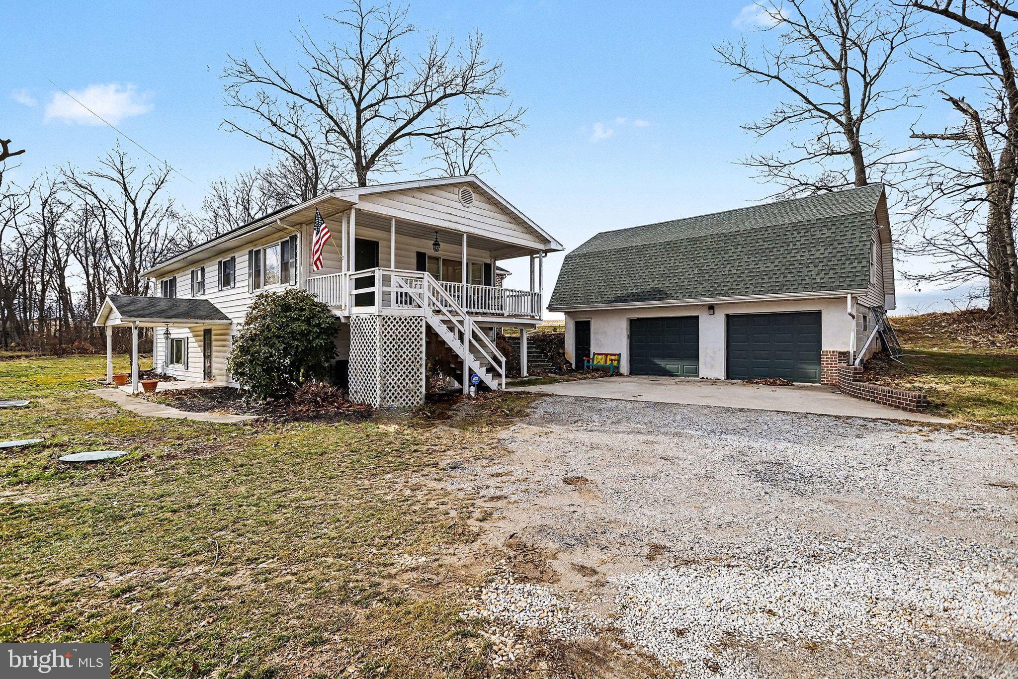 5405 West Canal Road East Berlin, PA 17316 - Photo 30 of 45 a front view of a house with a yard and garage