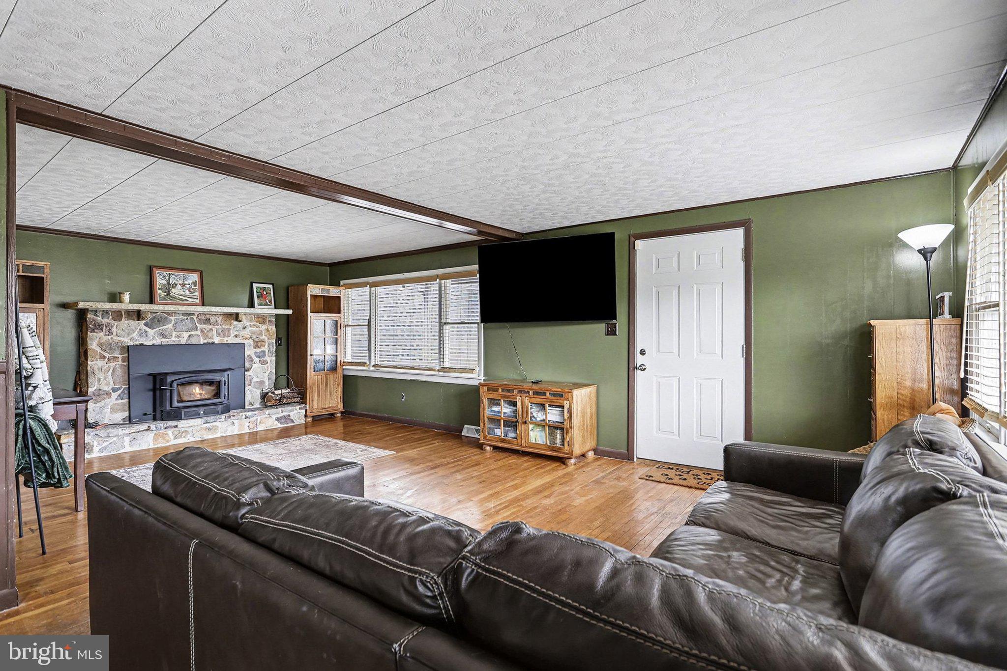 5405 West Canal Road East Berlin, PA 17316 - Photo 4 of 45 a living room with furniture and a fireplace