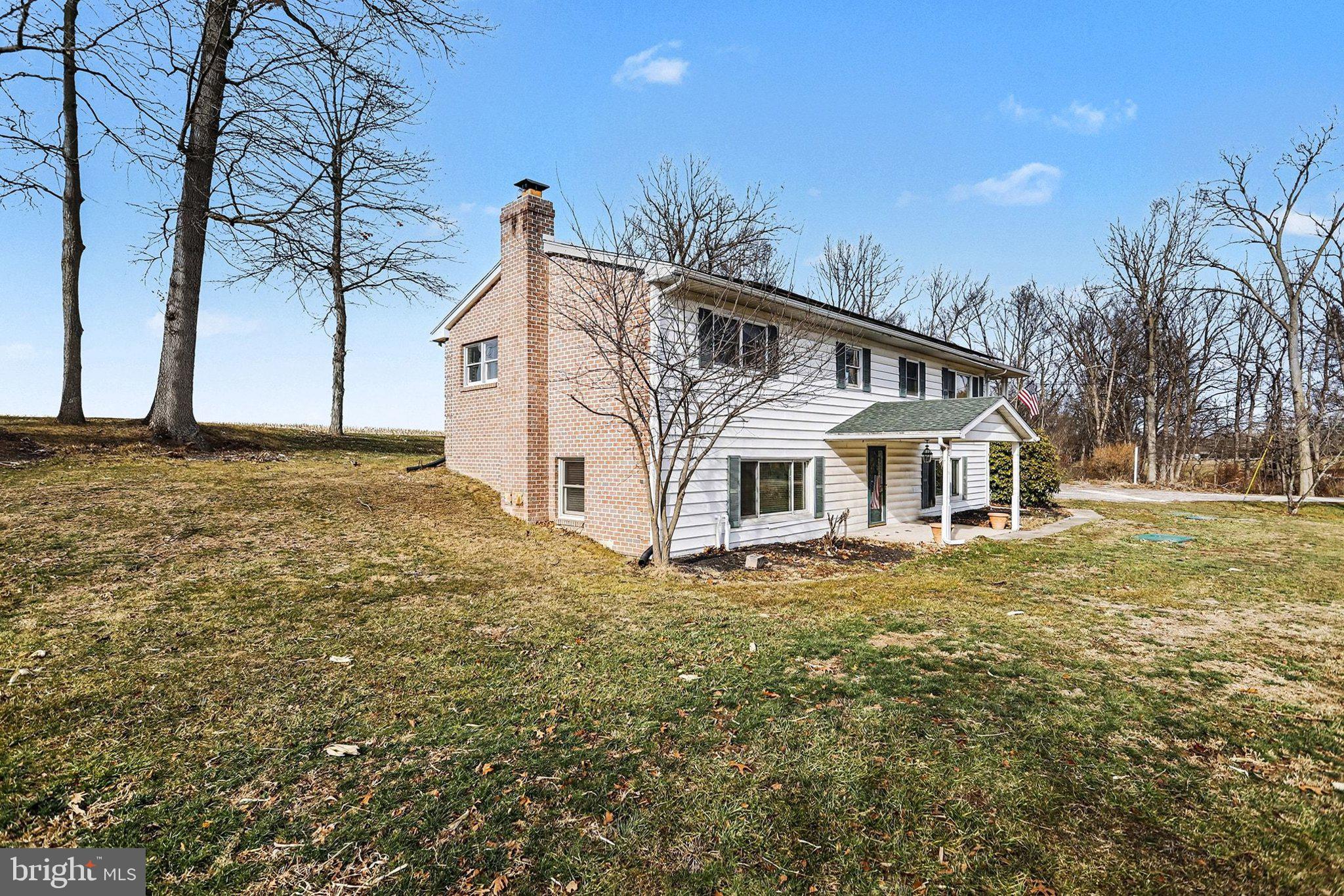 5405 West Canal Road East Berlin, PA 17316 - Photo 5 of 45 a white house that has a tree in front of it