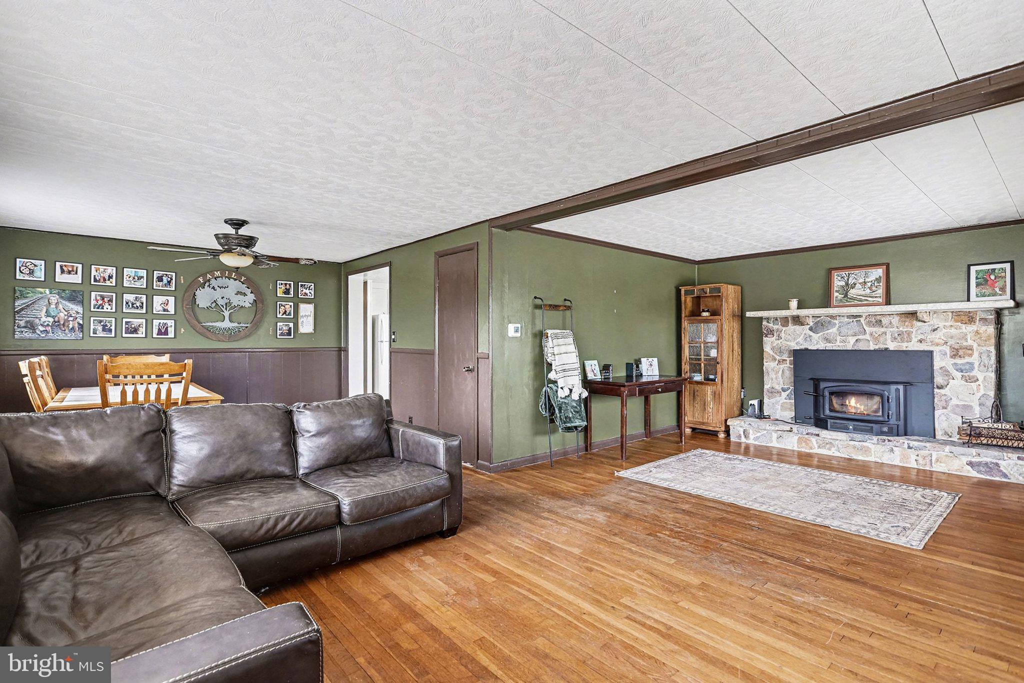5405 West Canal Road East Berlin, PA 17316 - Photo 8 of 45 a living room with furniture and a fireplace
