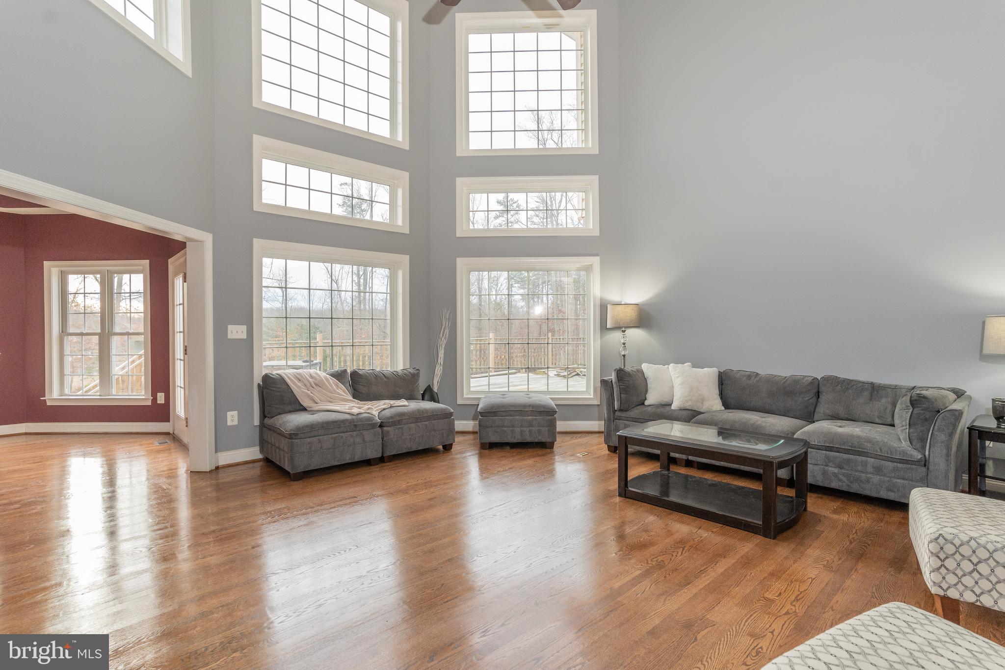 1585 Aquia Road Midland, VA 22728 - Photo 16 of 57 Main level living room floor to ceiling windows