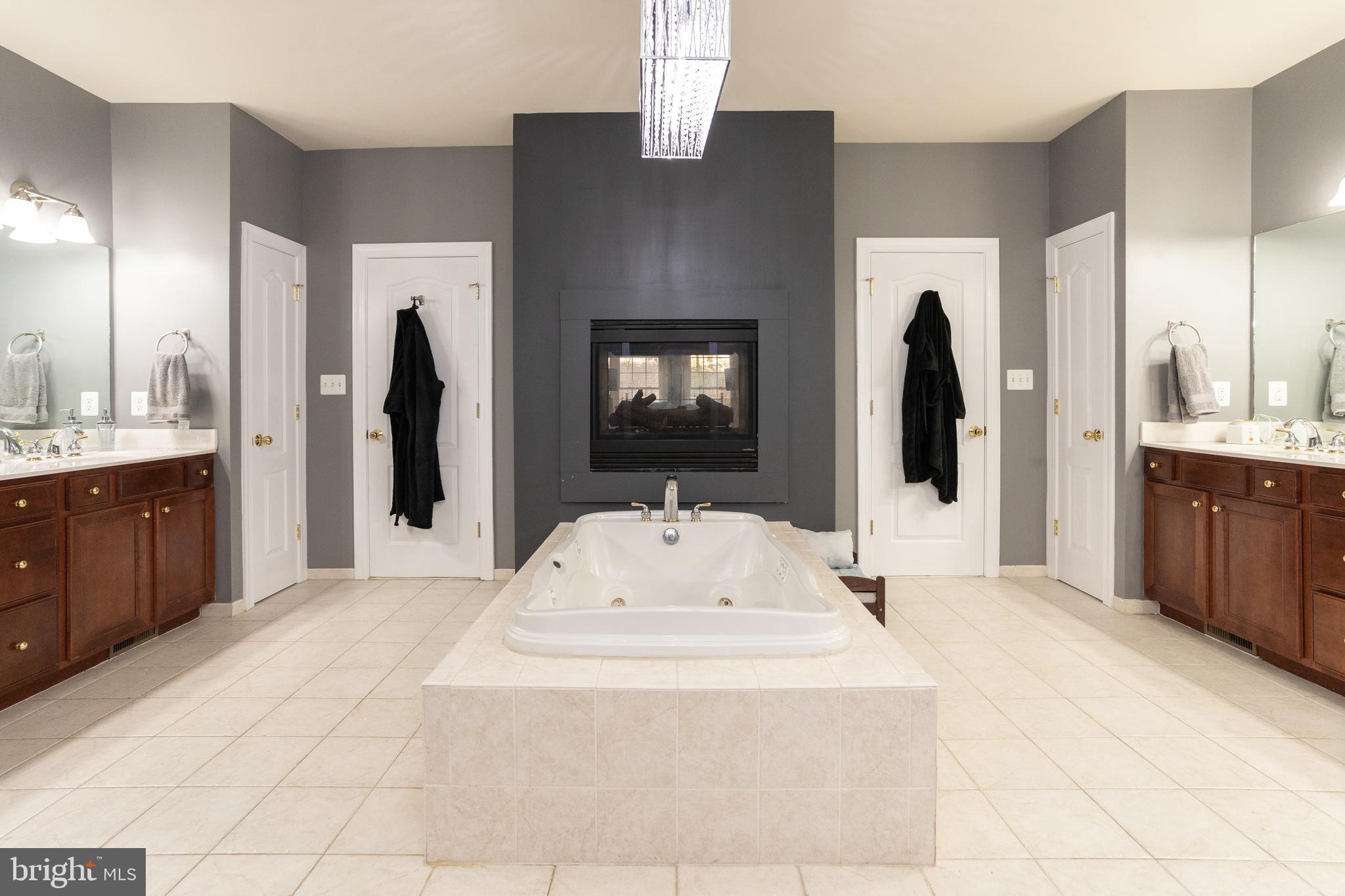 1585 Aquia Road Midland, VA 22728 - Photo 24 of 57 Large spa tub with fireplace master bedroom
