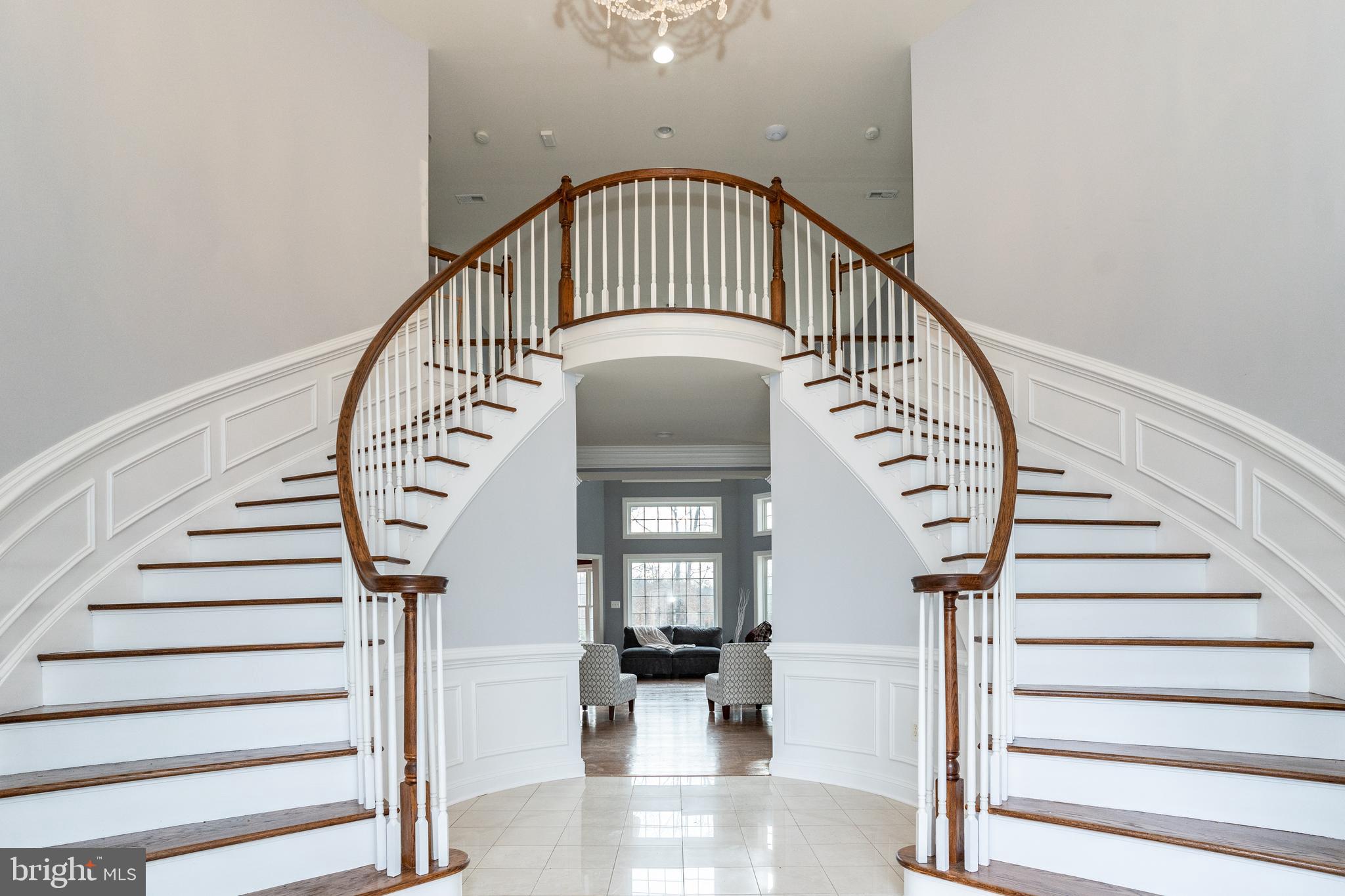 1585 Aquia Road Midland, VA 22728 - Photo 5 of 57 Stairway w/large chandelier lowers to change bulbs