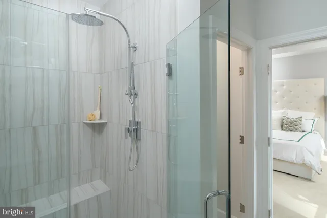 a bathroom with a glass shower door