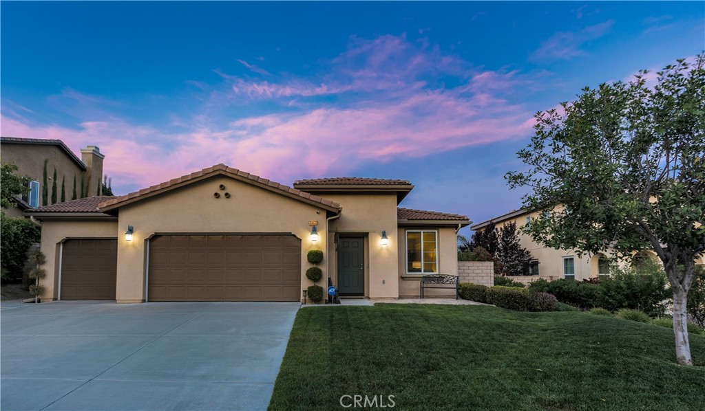 35622 Dulock Road Wildomar, CA 92595 - Photo 1 of 1 a front view of a house with a yard and garage