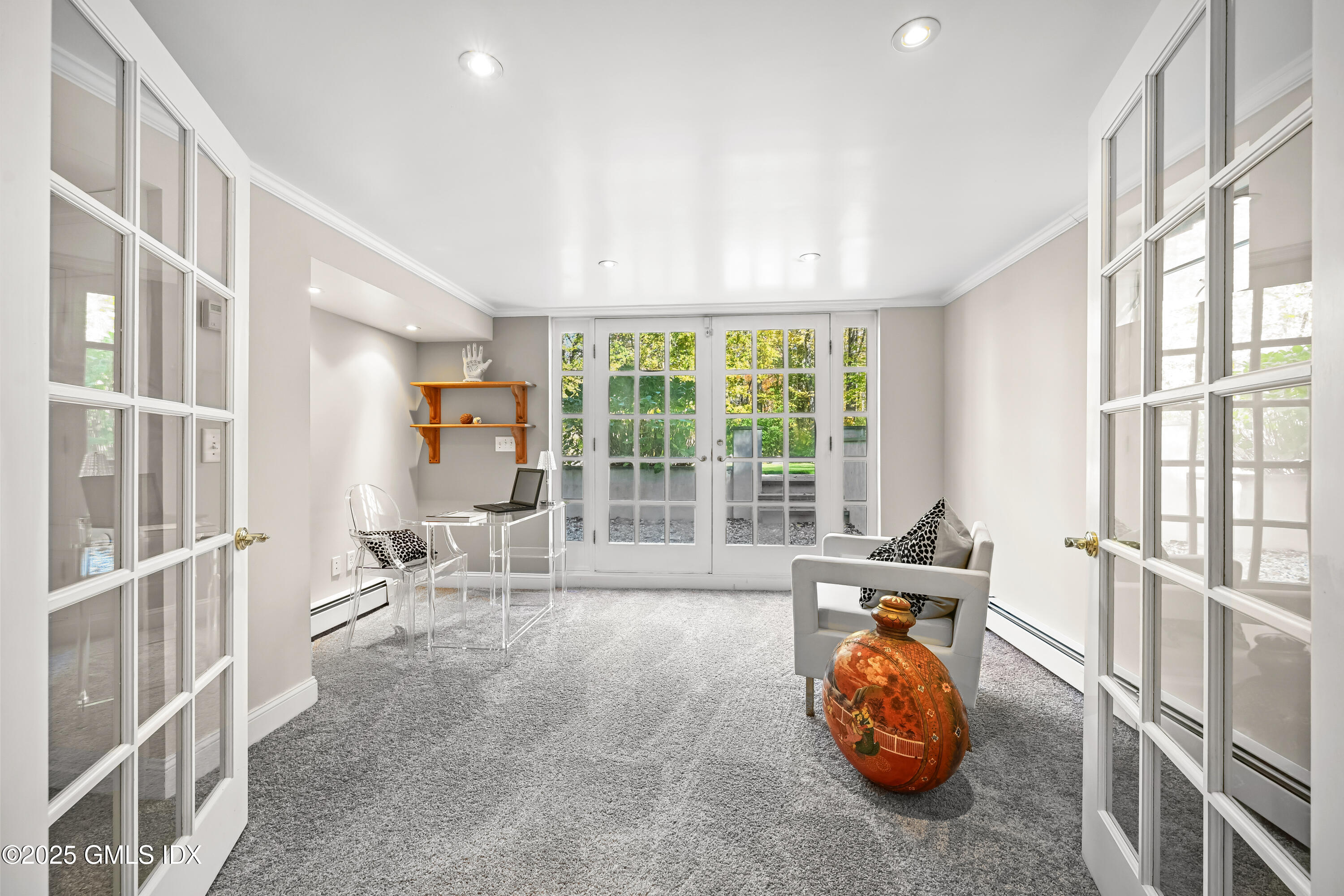 38 Bedford Road Greenwich, CT 06831 - Photo 20 of 32 a living room with furniture and a large window