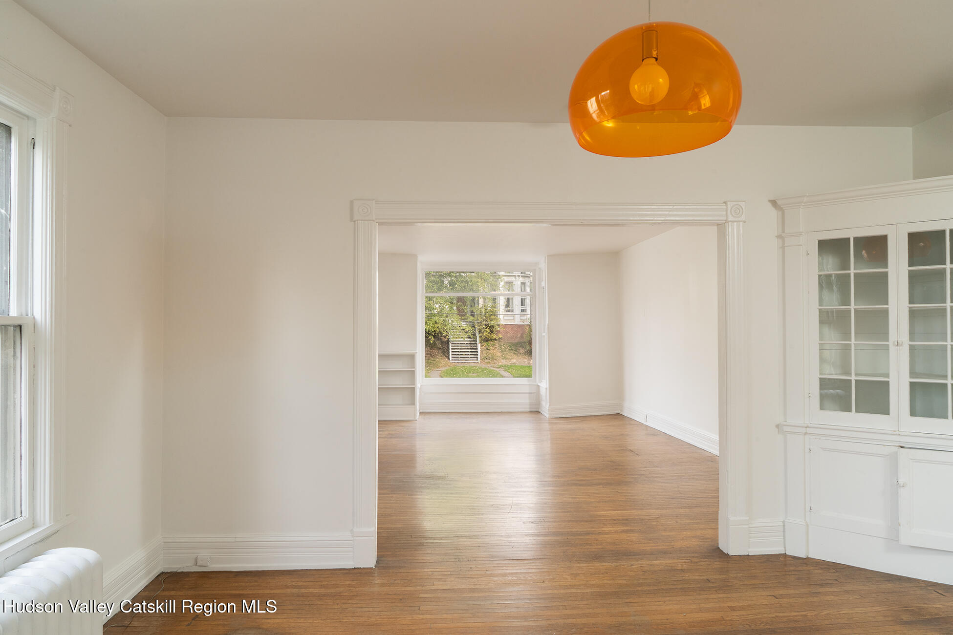 267 Main Street Catskill, NY 12414 - Photo 16 of 29 an empty room with wooden floor and windows
