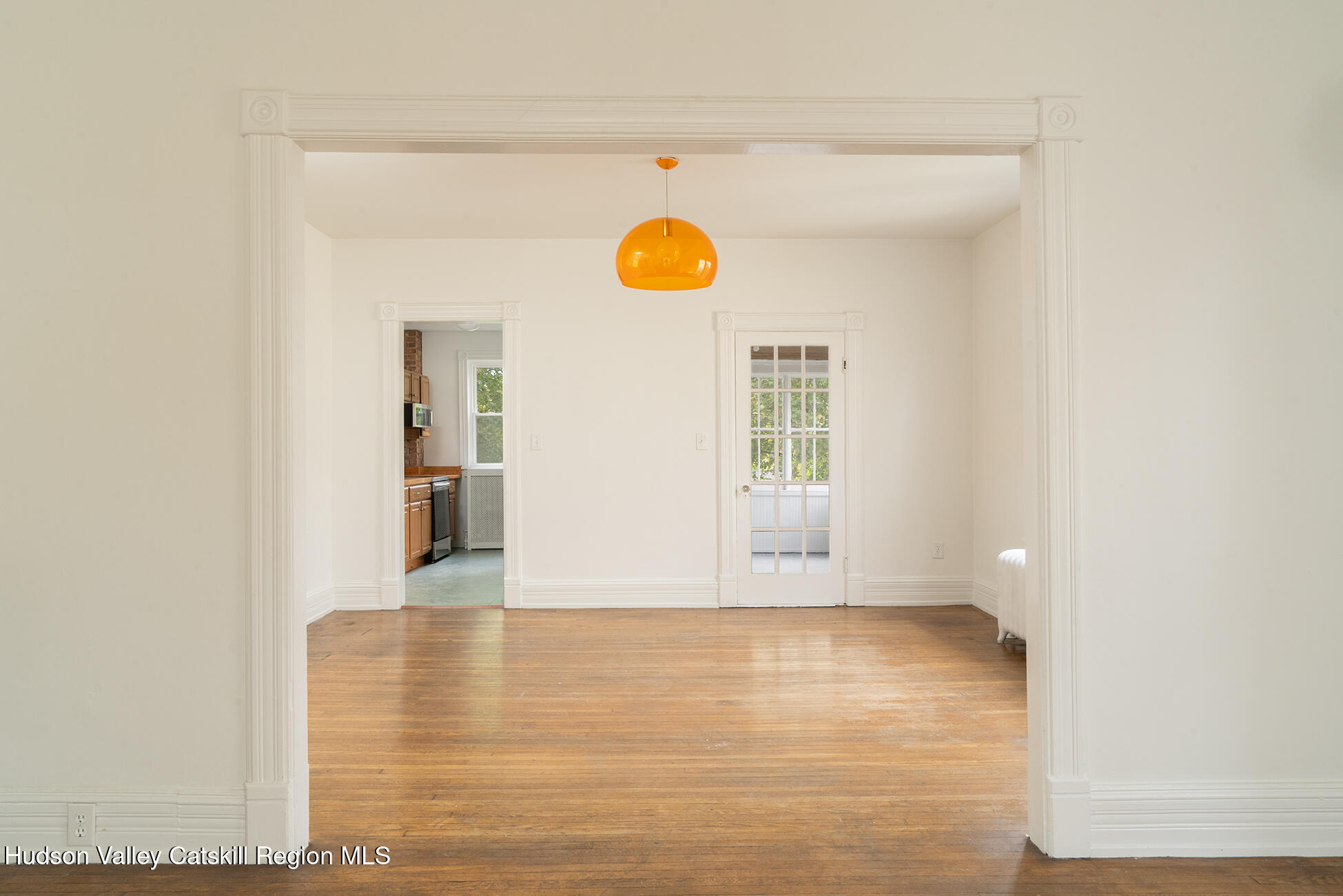 267 Main Street Catskill, NY 12414 - Photo 17 of 29 a view of an empty room with wooden floor and a window