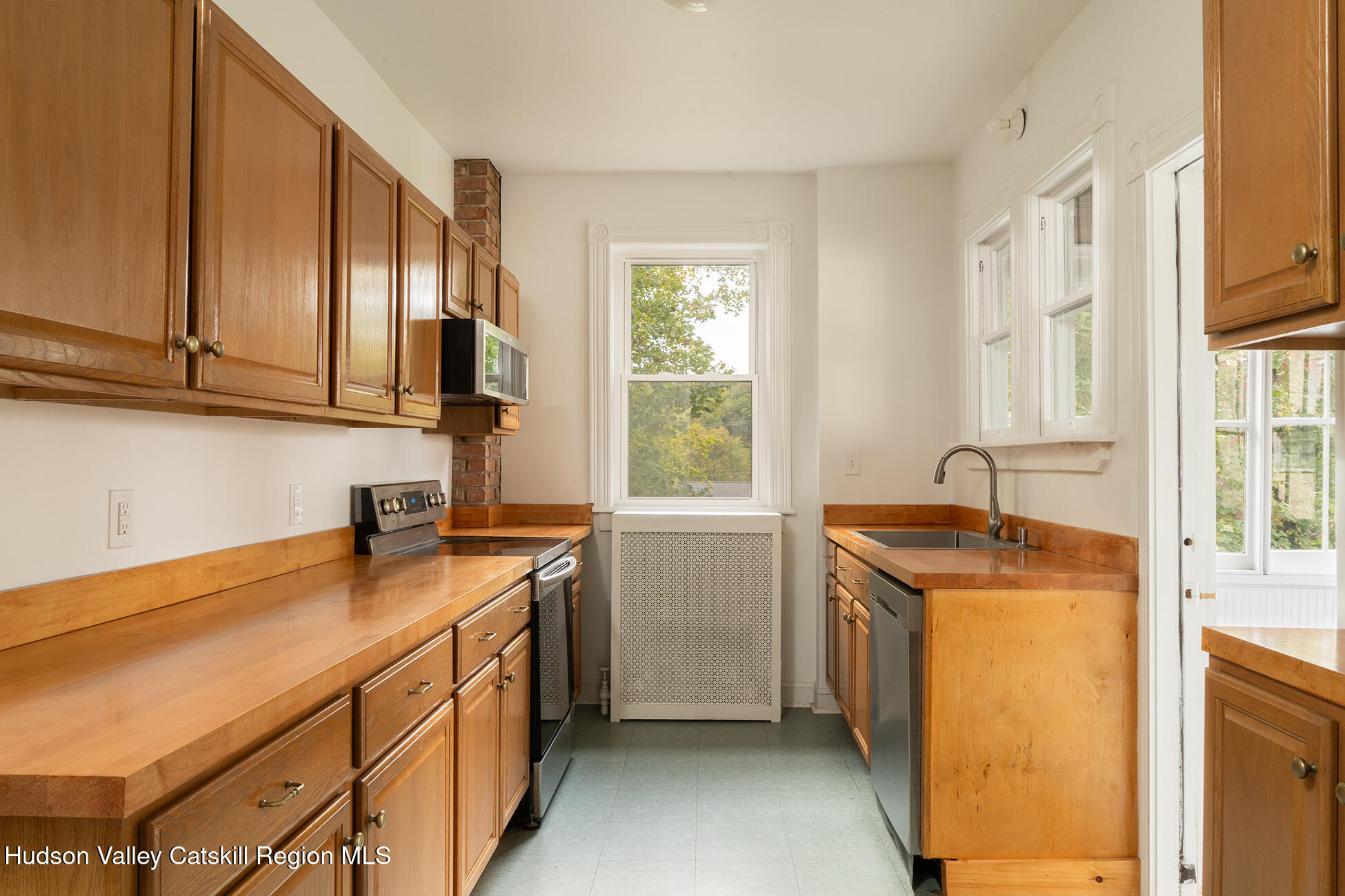 267 Main Street Catskill, NY 12414 - Photo 19 of 29 a utility room with cabinets washer and dryer