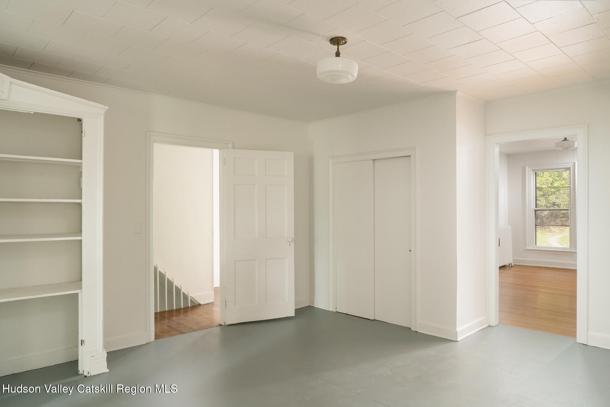 267 Main Street Catskill, NY 12414 - Photo 21 of 29 a view of an empty room with closet and a window
