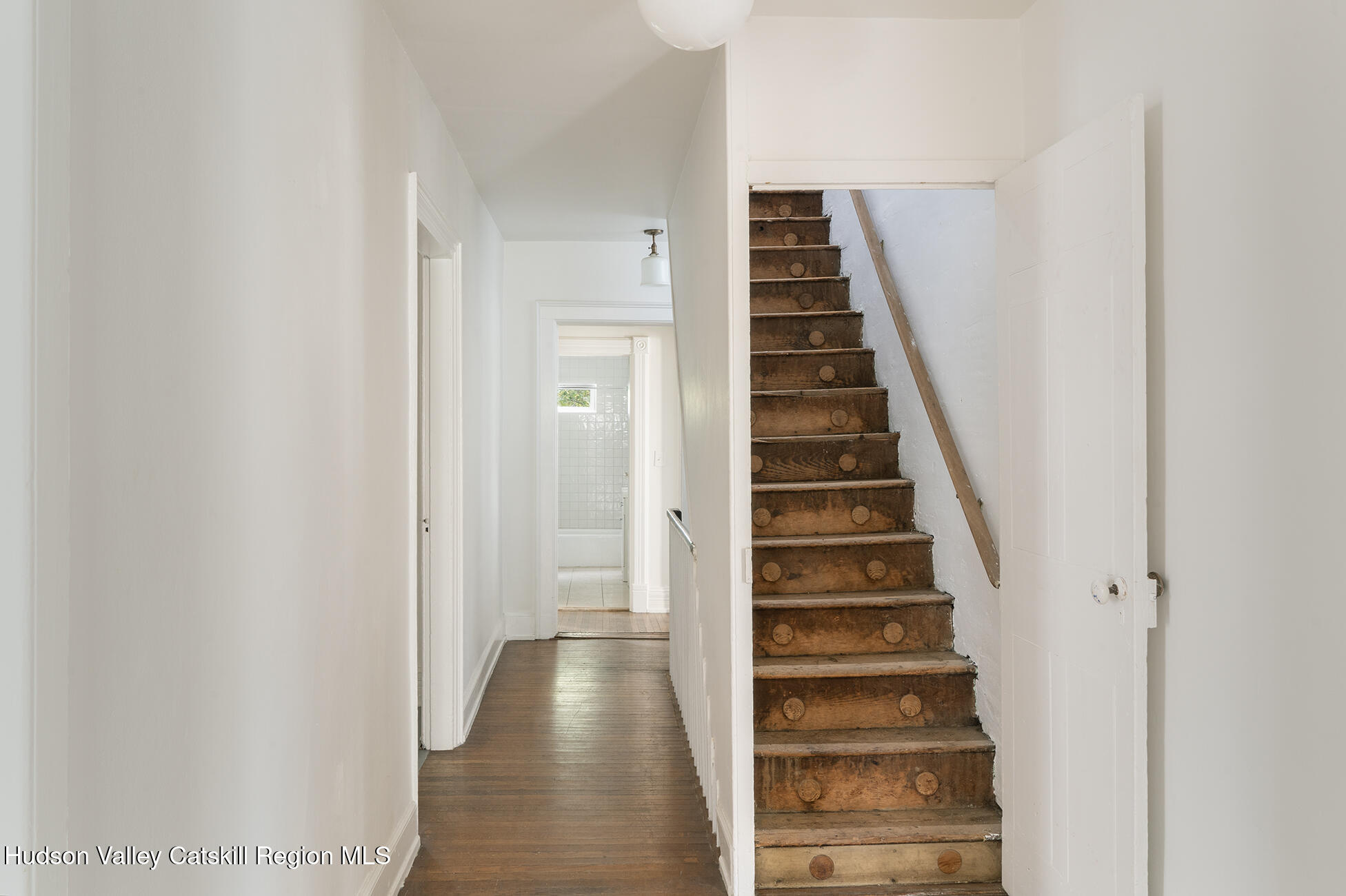 267 Main Street Catskill, NY 12414 - Photo 25 of 29 a view of a hallway with front door wooden floor and entryway