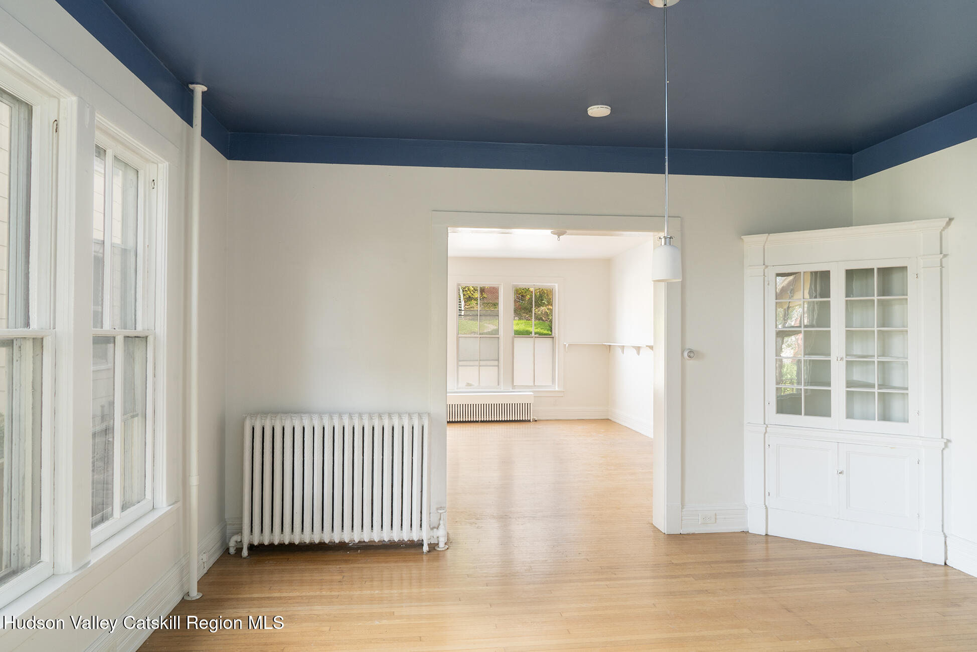 267 Main Street Catskill, NY 12414 - Photo 7 of 29 wooden floor in an empty room with a window
