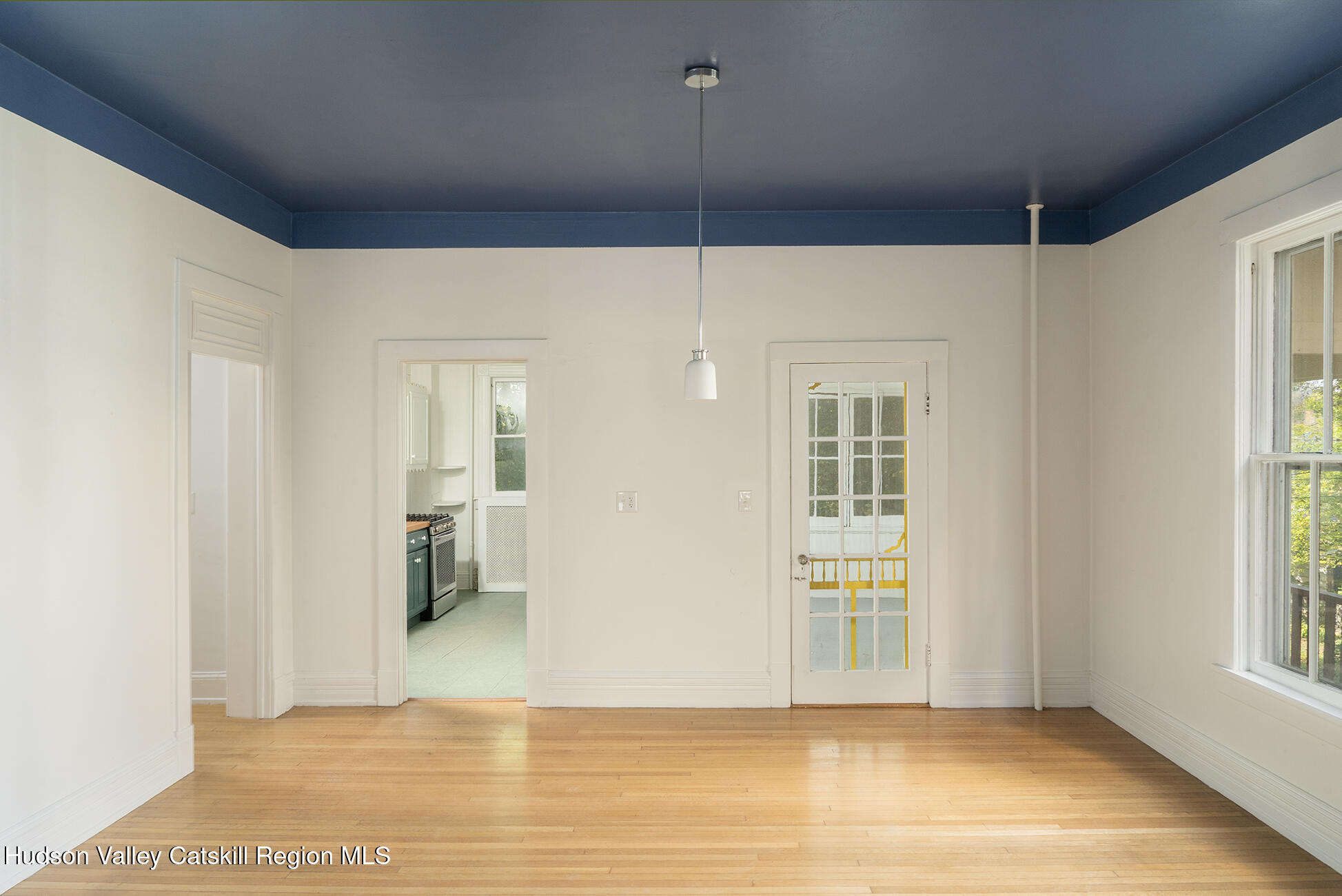 267 Main Street Catskill, NY 12414 - Photo 8 of 29 a view of an empty room with window and wooden floor