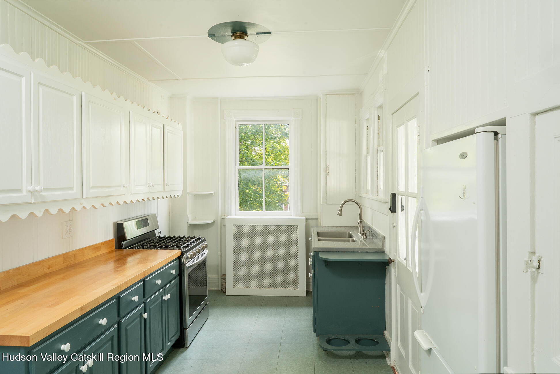 267 Main Street Catskill, NY 12414 - Photo 10 of 29 a kitchen with a sink and a window