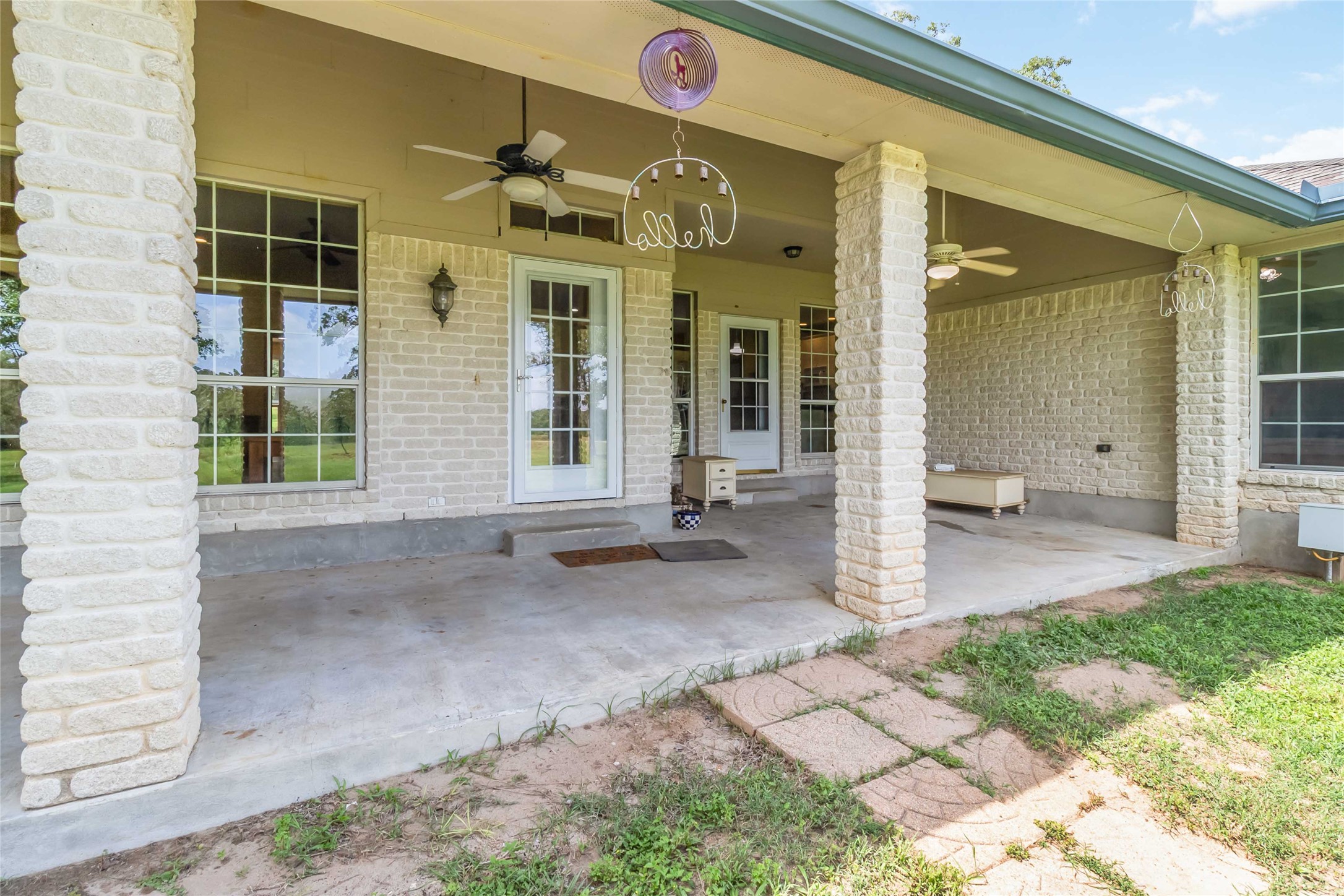 1208 Jeddo Road Rosanky, TX 78953 - Photo 3 of 40 A spacious covered patio provides a delightful outdoor living space.