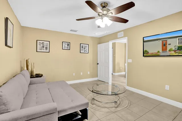 a living room with furniture and a table
