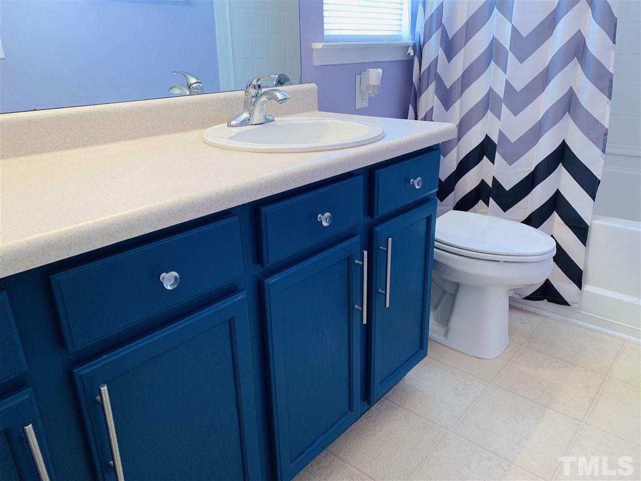 2529 Quarry Ridge Lane Raleigh, NC 27610 - Photo 14 of 26 a bathroom with a sink and a toilet