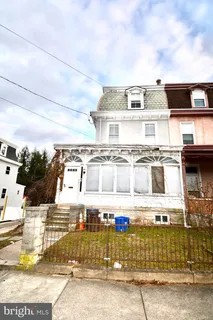 a front view of a house with a garage