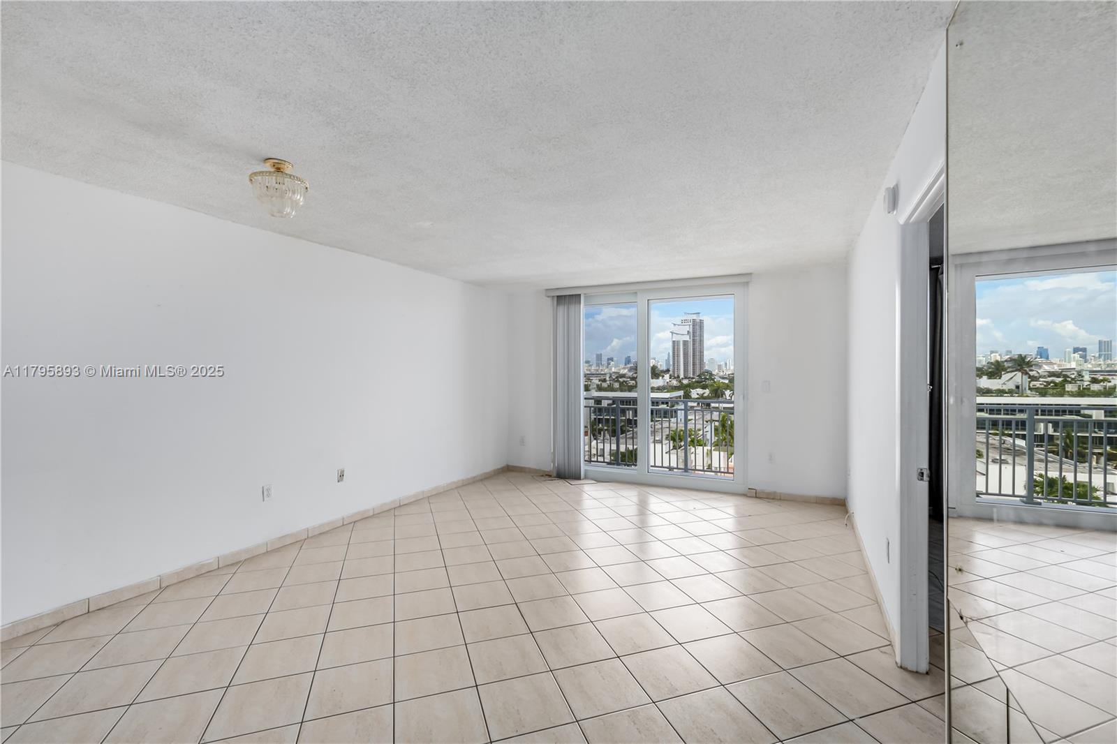 345 Ocean Drive, Unit 904 Miami Beach, FL 33139 - Photo 7 of 36 a view of an empty room and window