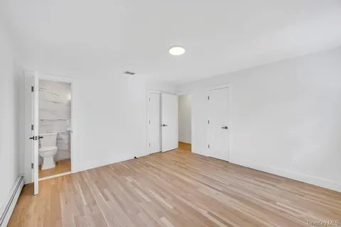 a view of a hallway with washer and dryer