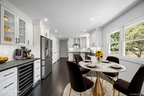 a view of a dining room with furniture window and outside view