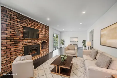 a kitchen with a dining table chairs and refrigerator