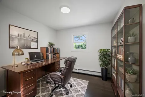 a bedroom with a bed and a potted plant