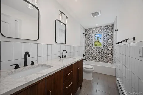 a view of a workspace with furniture and a potted plant