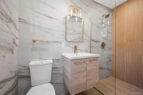 a bedroom with furniture and flat screen tv