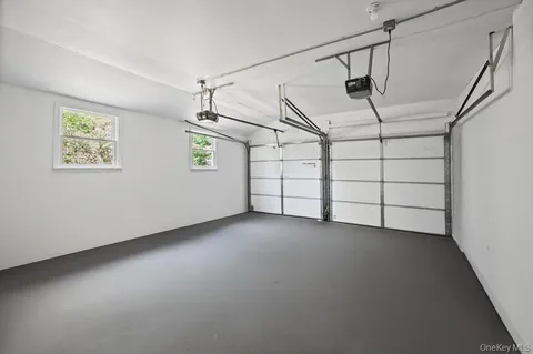 a view of a yard with a large tree