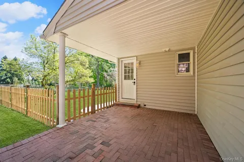 a view of a backyard with wooden floor