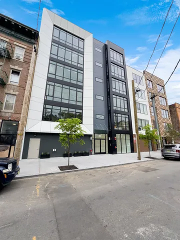 a view of a building with a street