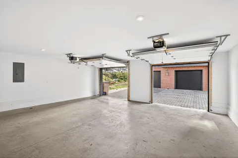 an aerial view of a house with a swimming pool