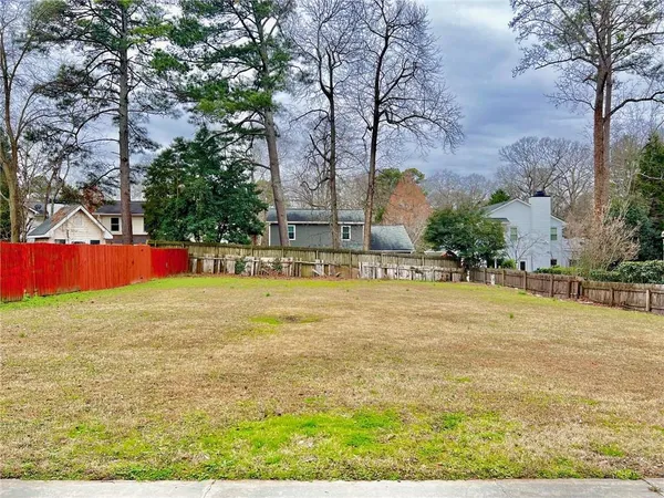 a view of swimming pool with trees in the background