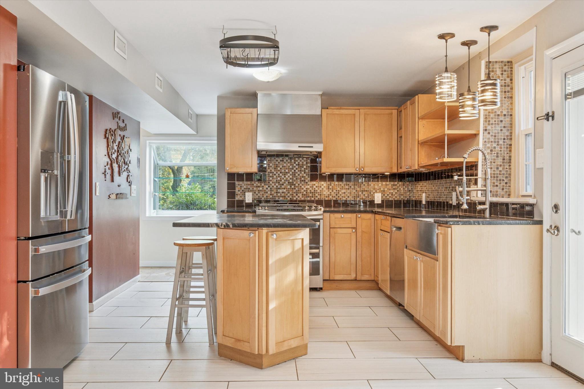504 Plymouth Road Glenside, PA 19038 - Photo 11 of 28 a kitchen with stainless steel appliances granite countertop a refrigerator and a stove top oven