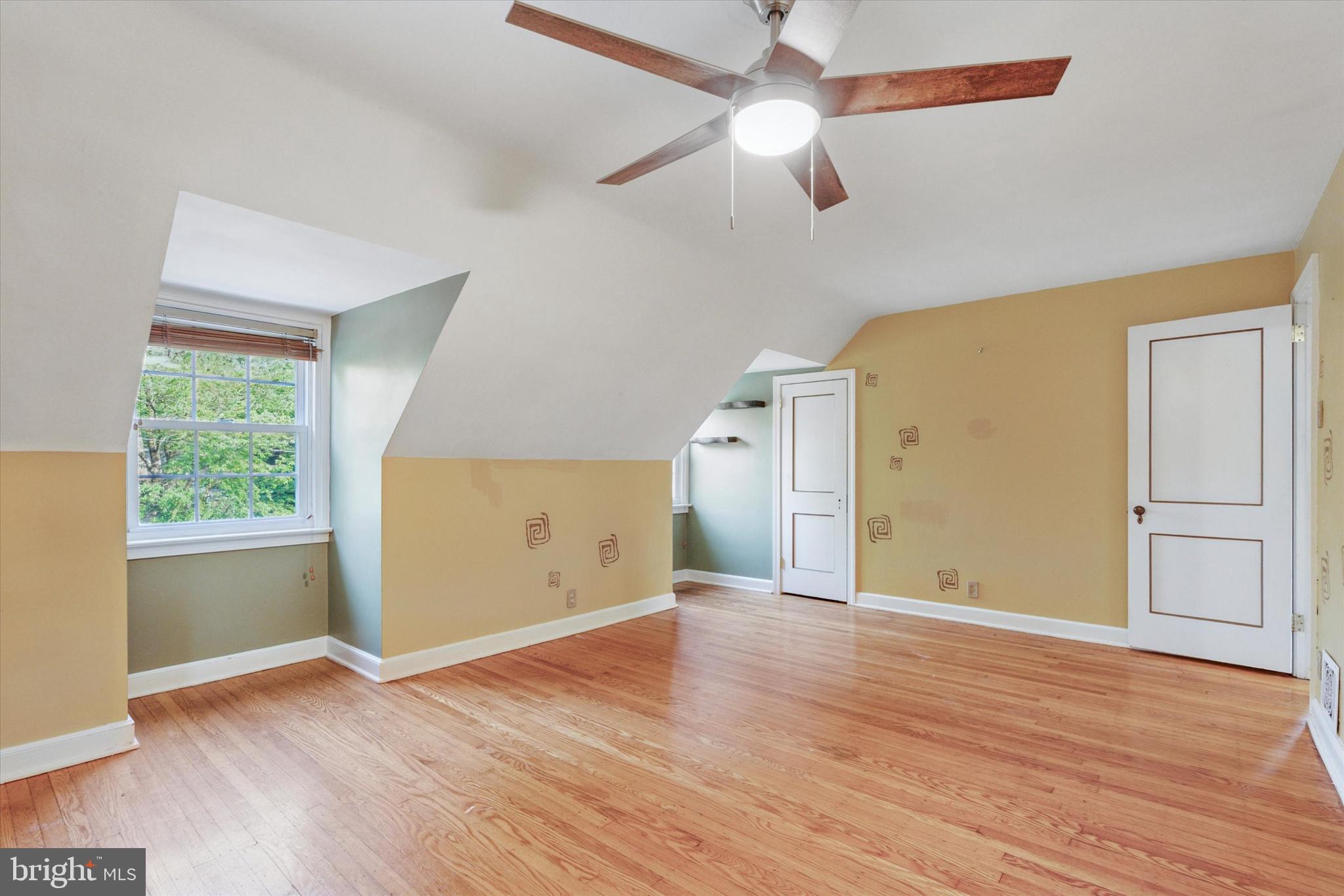 504 Plymouth Road Glenside, PA 19038 - Photo 20 of 28 an empty room with wooden floor cabinet and windows