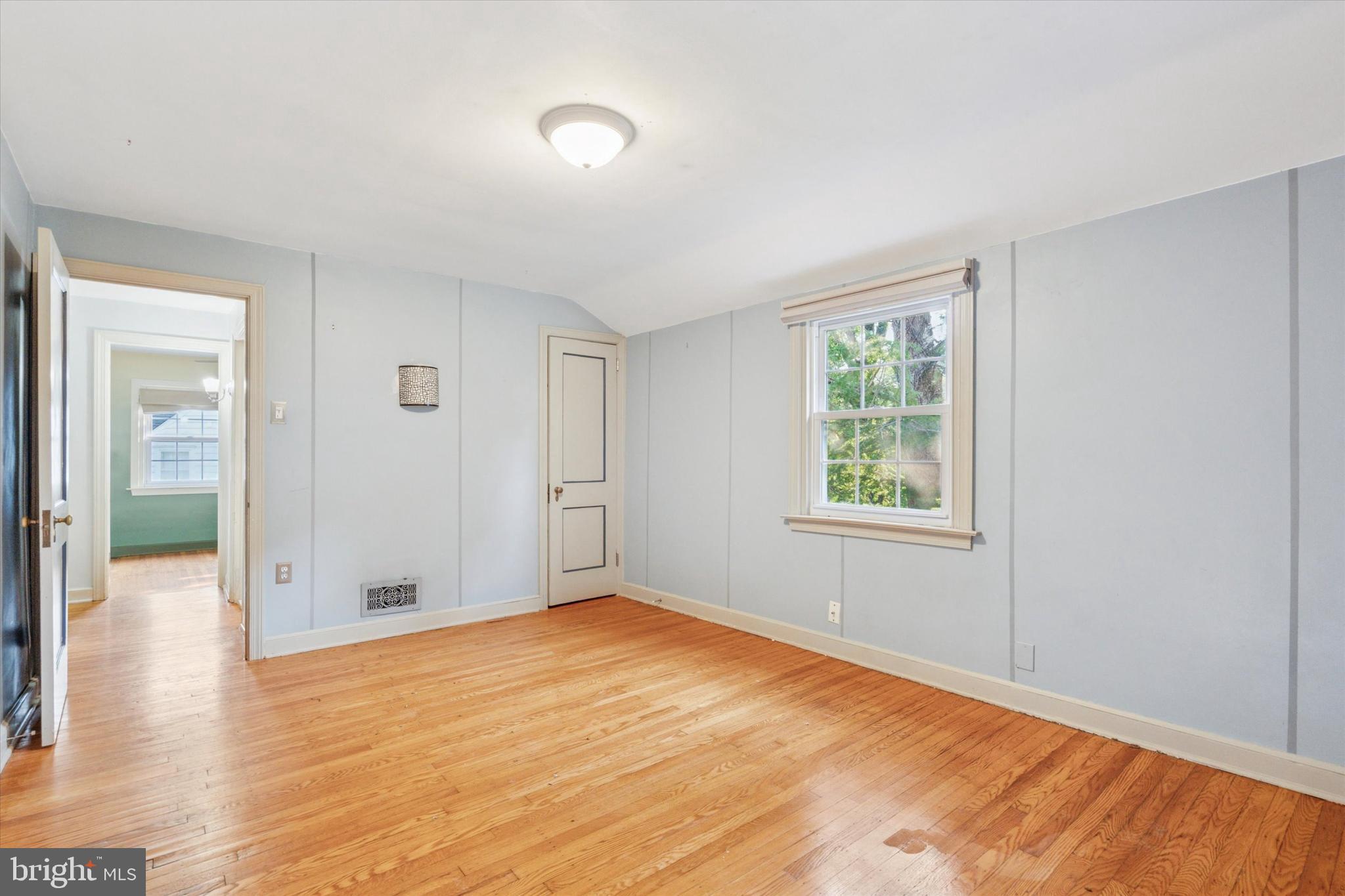 504 Plymouth Road Glenside, PA 19038 - Photo 23 of 28 an empty room with wooden floor and windows