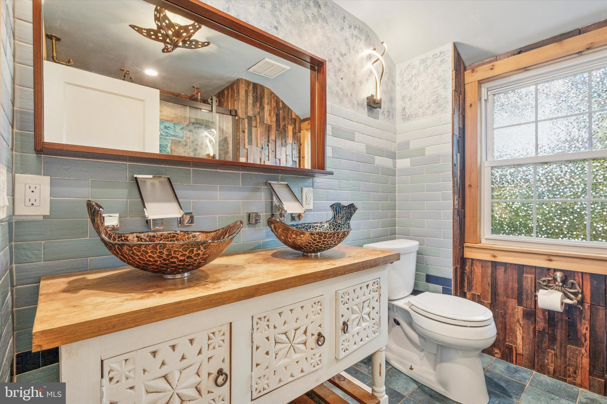 504 Plymouth Road Glenside, PA 19038 - Photo 25 of 28 a bathroom with a granite countertop sink a toilet a mirror and window