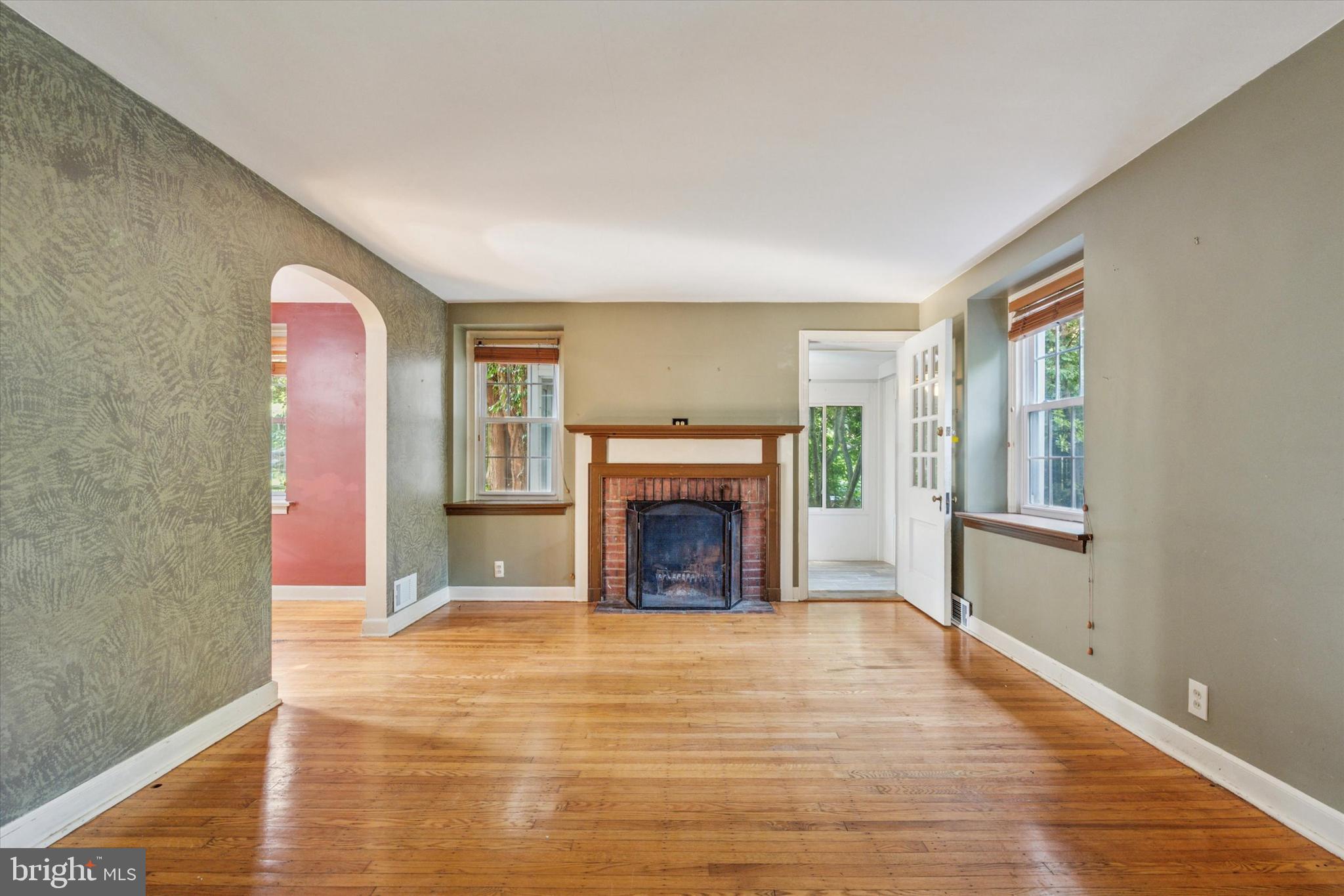 504 Plymouth Road Glenside, PA 19038 - Photo 3 of 28 a view of an empty room with window and fireplace