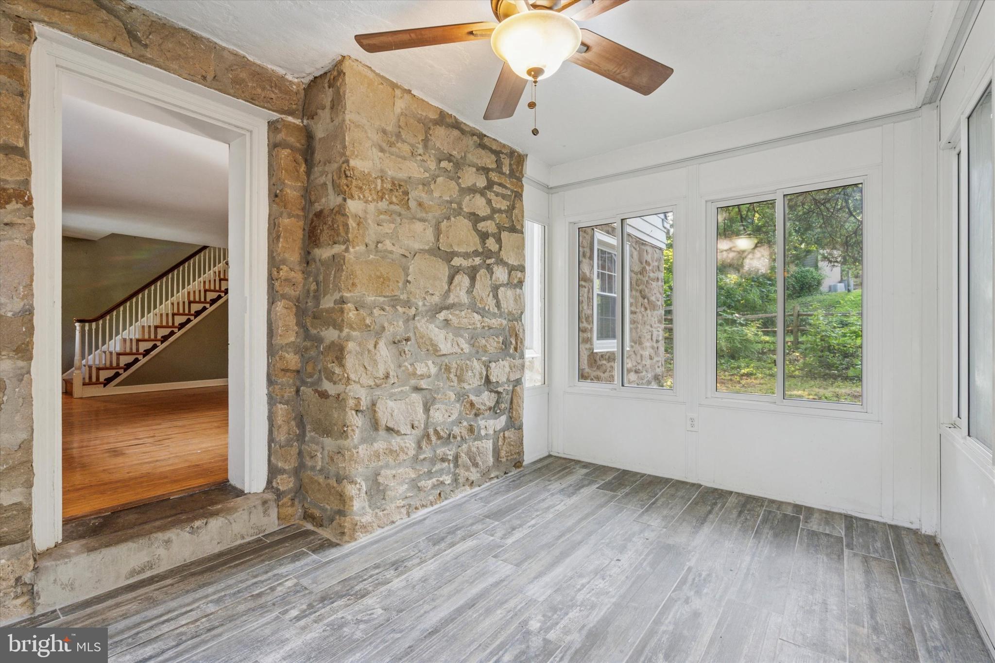 504 Plymouth Road Glenside, PA 19038 - Photo 7 of 28 wooden floor in an empty room with a window