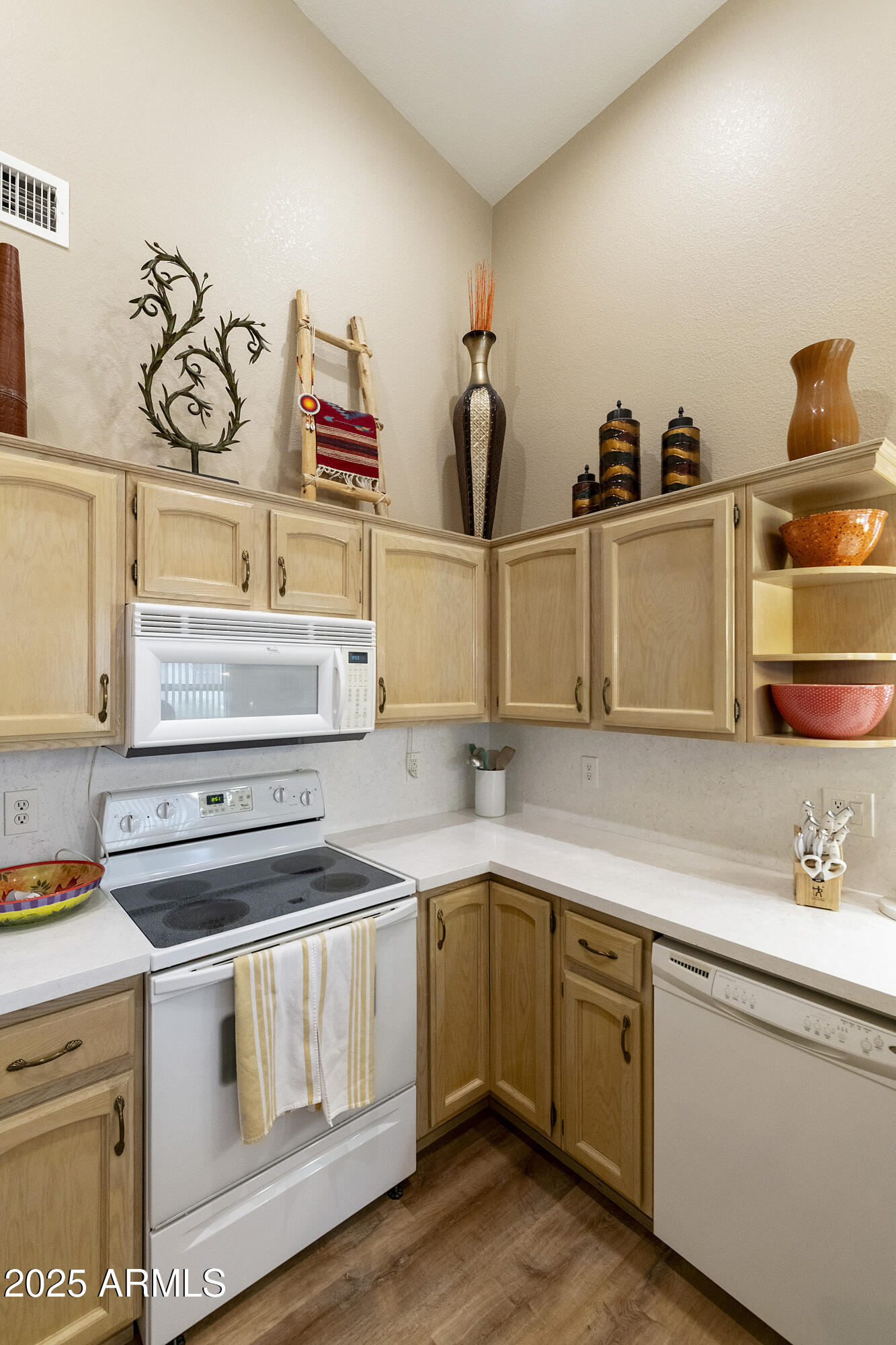 23745 South Vacation Way Sun Lakes, AZ 85248 - Photo 12 of 52 a kitchen with a stove and cabinets