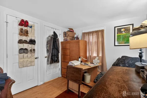 a bed room with furniture and a gym machine