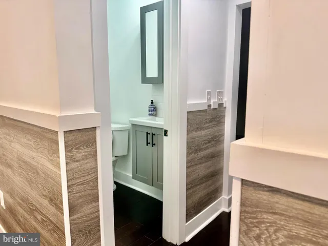 a bathroom with a shower and a sink