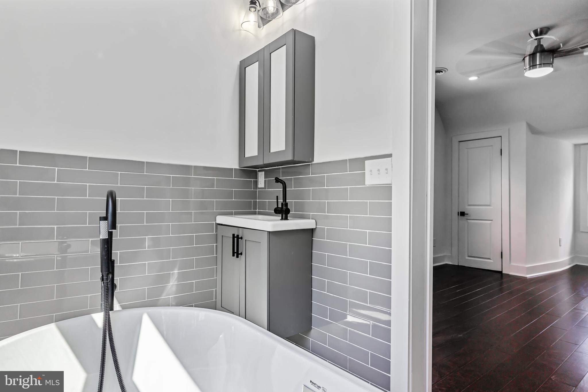 3408 Cheverly Avenue Cheverly, MD 20785 - Photo 19 of 46 a bathroom with a sink and a mirror