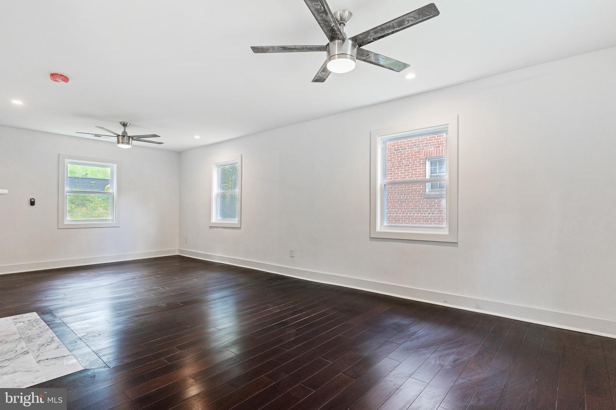 3408 Cheverly Avenue Cheverly, MD 20785 - Photo 6 of 46 a view of an empty room with wooden floor and a window