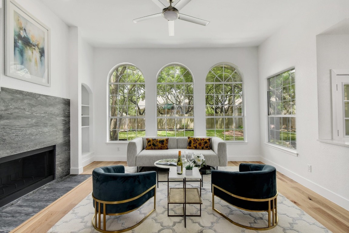 a living room with furniture and a large window