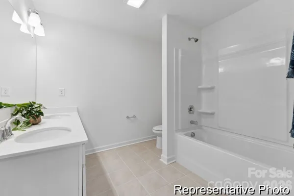 a white bath tub sitting in a bathroom